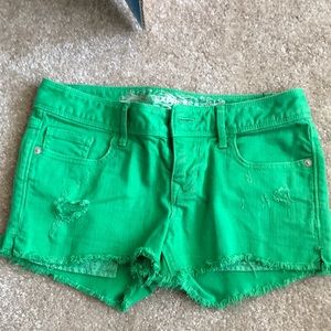 Express green distressed jean shorts
